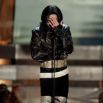Michael Jackson performing on stage with inspirational quote overlay
